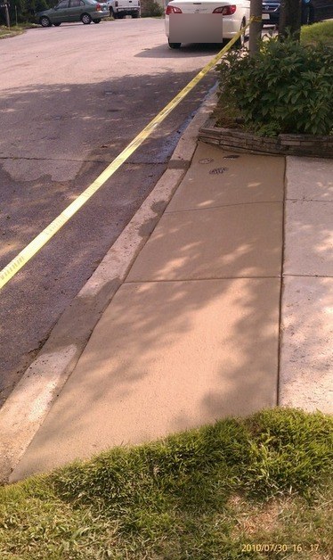 After: new curb and sidewalk at the same driveway apron