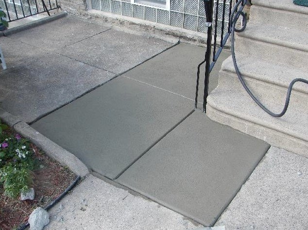 New concrete slab poured beside front steps in Philadelphia