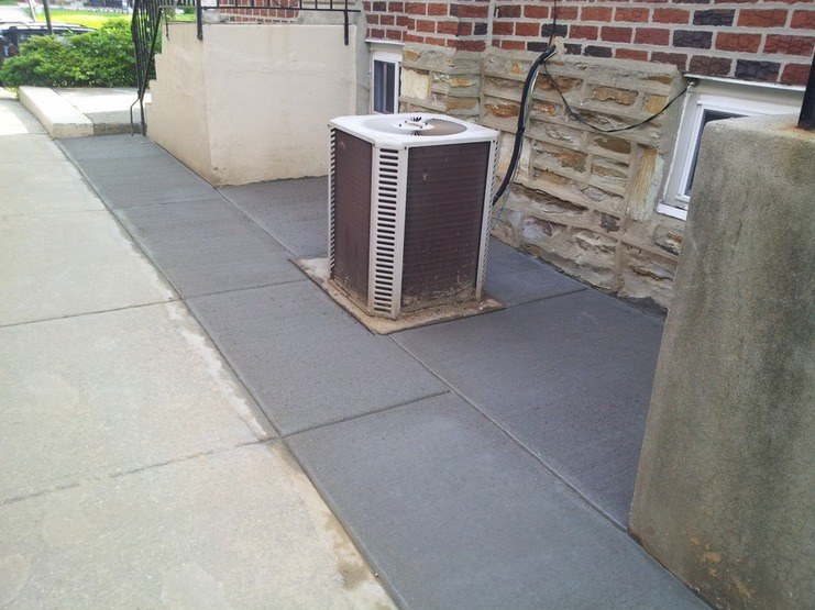 After: new concrete patio in the same side yard