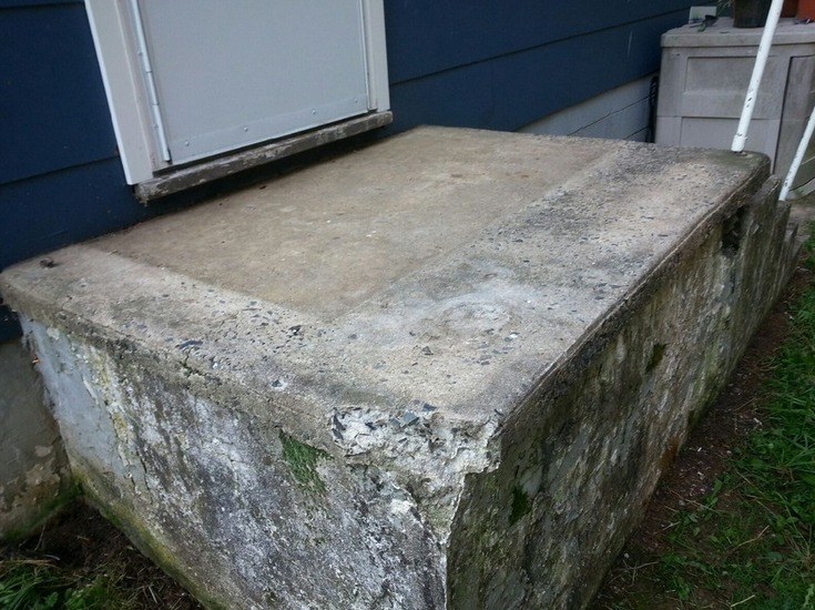 Before: weathered, flaking concrete steps ahead of resurfacing